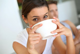Portrait of young woman having breakfast