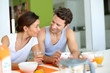 Photo: Couple having breakfast at home Couple having breakfast at home