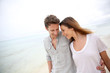 Romantic couple walking on the beach