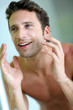 Closeup of handsome guy cleansing his face