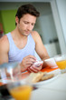 Man Using Smartphone While Hav... Man Using Smartphone While Hav...