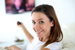 Foto: Portrait of young woman watching tv Portrait of young woman watching tv