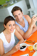 Young couple having breakfast at home