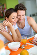 Couple having breakfast at home