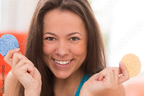 Photo: Young woman with cosmetic pillows Young woman with cosmetic pillows