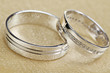Wedding rings on a beige satin