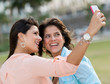 Girls taking a picture with the phone