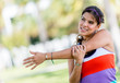 Fit woman stretching arm