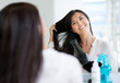 Woman blow drying her hair