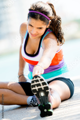 Photo: Woman doing stretches exercises Woman doing stretches exercises