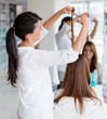 Woman cutting clients hair