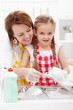 Little girl washing dishes