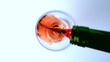 Overhead shot of red wine being poured into glass