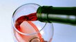 High angle shot of red wine being poured into glass
