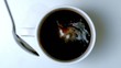 Video: Teaspoon pouring sugar into cup of coffee Teaspoon pouring sugar into cup of coffee