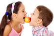 Photo: Two kids sharing the apple Two kids sharing the apple