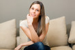 Young and beautiful woman on the sofa