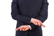 Business man with fingers crossed.