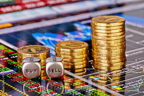 Photo: Uptrend stacks golden coins, dices cubes with the worsd SELL BUY Uptrend stacks golden coins, dices cubes with the worsd SELL BUY
