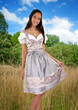 Illustration: Wunderhübsche Frau im Dirndl in der Natur Wunderhübsche Frau im Dirndl in der Natur