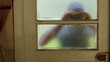 Intruder attempting to break into a garage, close up