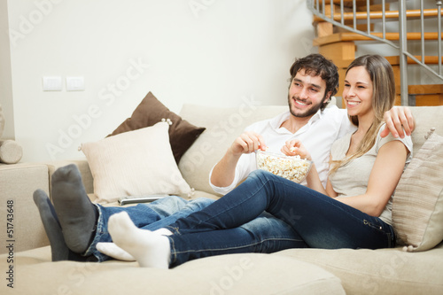 Photo: Couple watching a movie Couple watching a movie