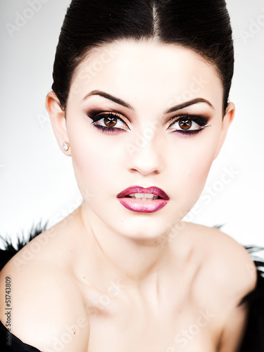 Photo: professional make-up and hairstyle on beautiful woman face professional make-up and hairstyle on beautiful woman face