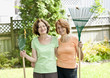 Photo: Women with rakes in garden Women with rakes in garden