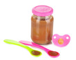 Baby food with baby supplies isolated on white