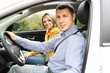 Portrait of young beautiful  couple sitting in the car