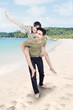 Asian couple having a good time at beautiful beach