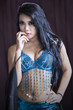 Foto: Attractive belly dancer in blue costumer Attractive belly dancer in blue costumer