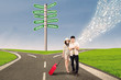 Couple travel at cross road using e-tablet