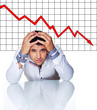 Photo: Sad businessman in front of graphic Sad businessman in front of graphic
