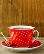 Foto: Red cup of coffee for breakfast Red cup of coffee for breakfast