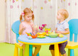 Photo: Two kids painting Easter eggs Two kids painting Easter eggs