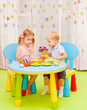 Photo: Little kids painting Easter eggs Little kids painting Easter eggs