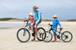 Father And Kids Riding Bikes
