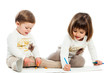 Two baby sisters drawing together.