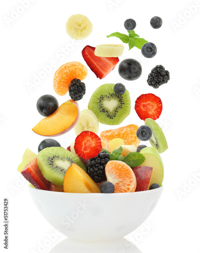 Photo: Fresh mixed fruit salad falling into a bowl of salad Fresh mixed fruit salad falling into a bowl of salad