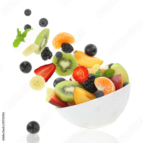 Photo: Fresh fruits coming out from a bowl Fresh fruits coming out from a bowl