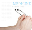 Hand holding a stethoscope isolated on white