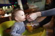 Toddler drinks juice