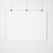 blank paper with clips on wood background