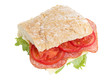 big sandwich with salami cheese tomato and salad leaves