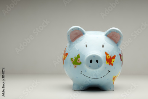 Photo: Colourful cermanic piggy bank isolated Colourful cermanic piggy bank isolated