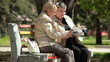 Senior Women Reading Magazines In The Park
