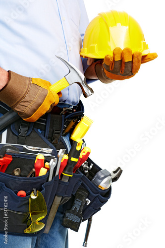 Photo: Worker with a tool belt. Construction. Worker with a tool belt. Construction.