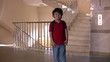 Little student walking down the stairs