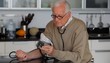 Senior Caucasian man checking his blood pressure